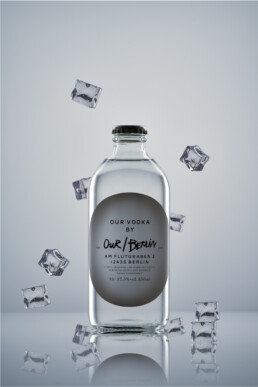 a bottle of Our Vodka Berlin with flying ice cubes